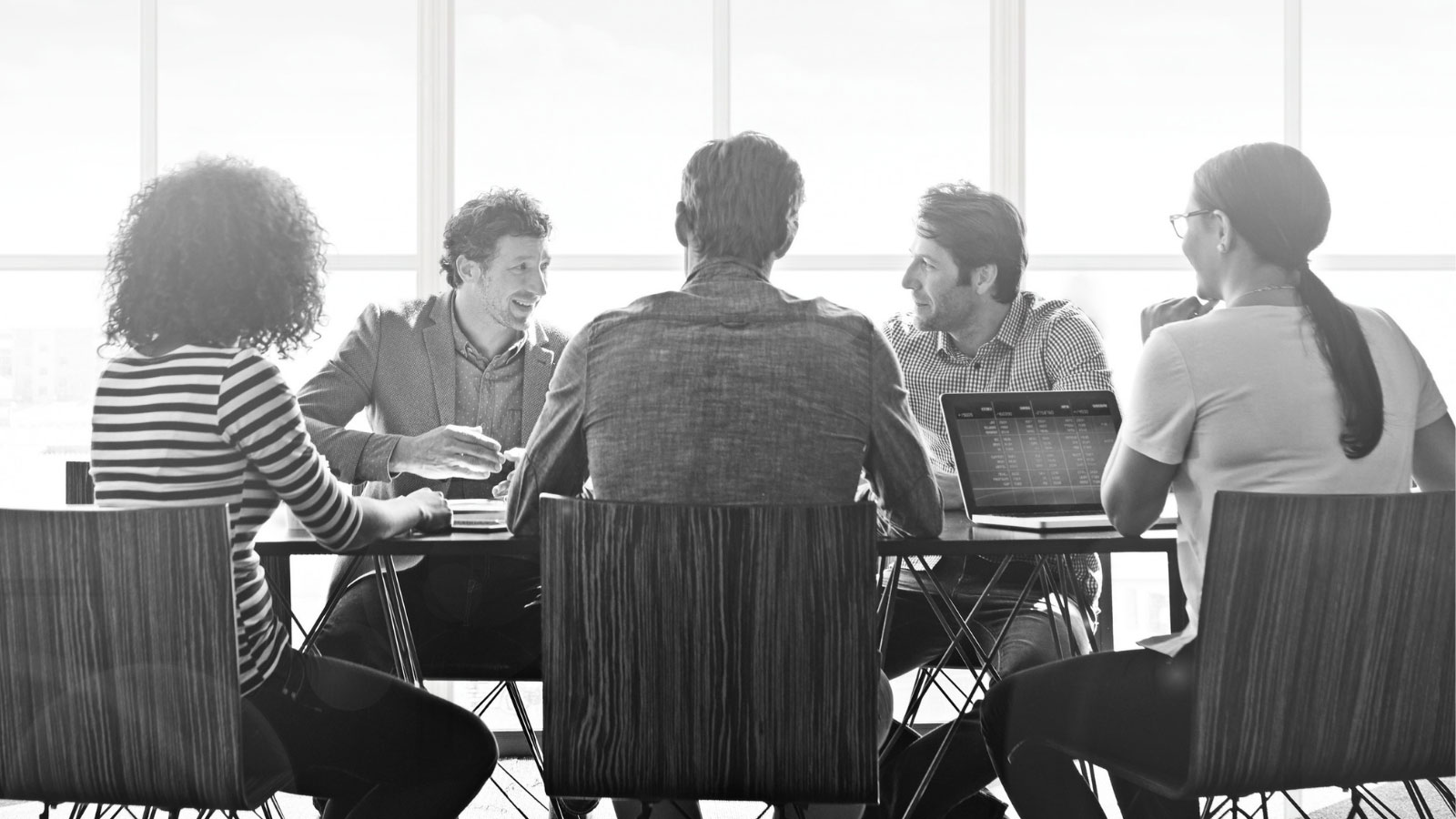 five people having meeting discussion at office